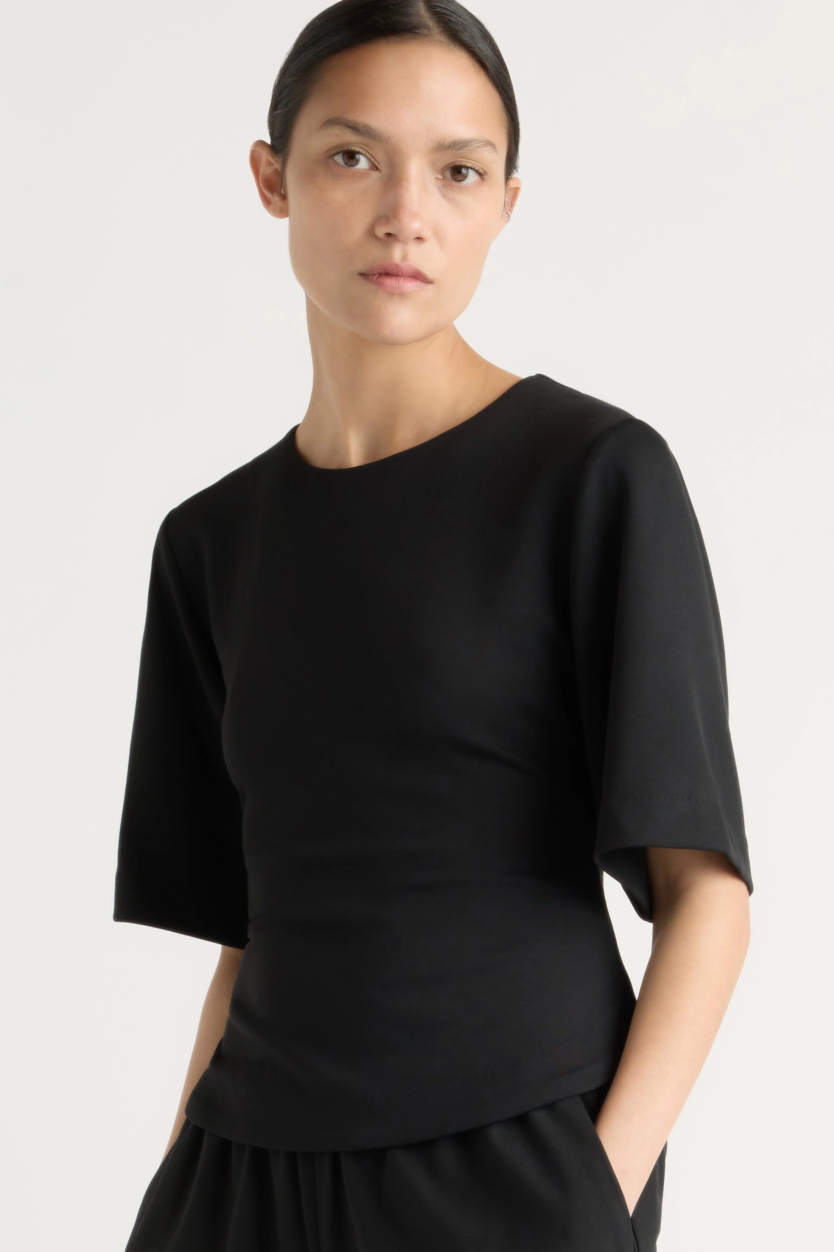 Reem Sculpted Curved-Hem Tee - Image 7